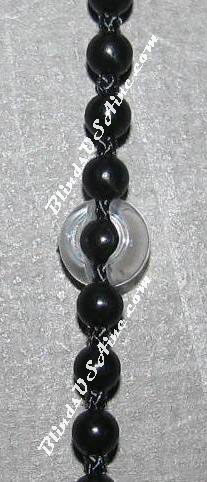 Display photo of plastic Chain Stopper connected to chain
