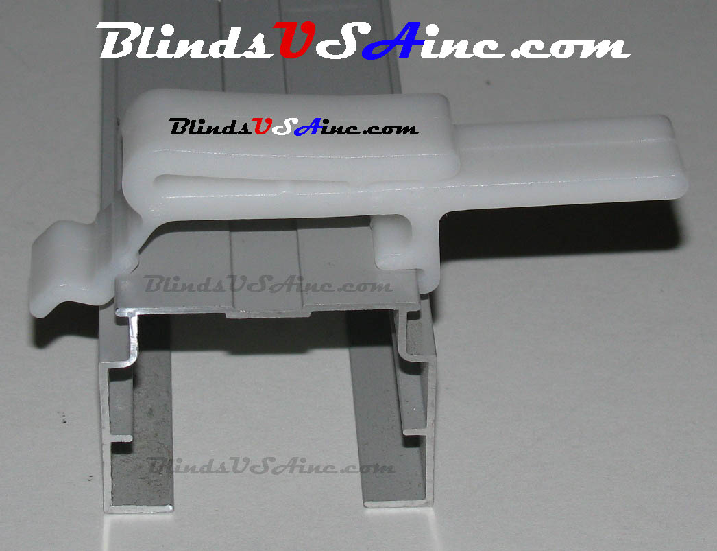Example of a Dust cover valance clip, item # VCL-DCL3 attached to a vertical blind rail